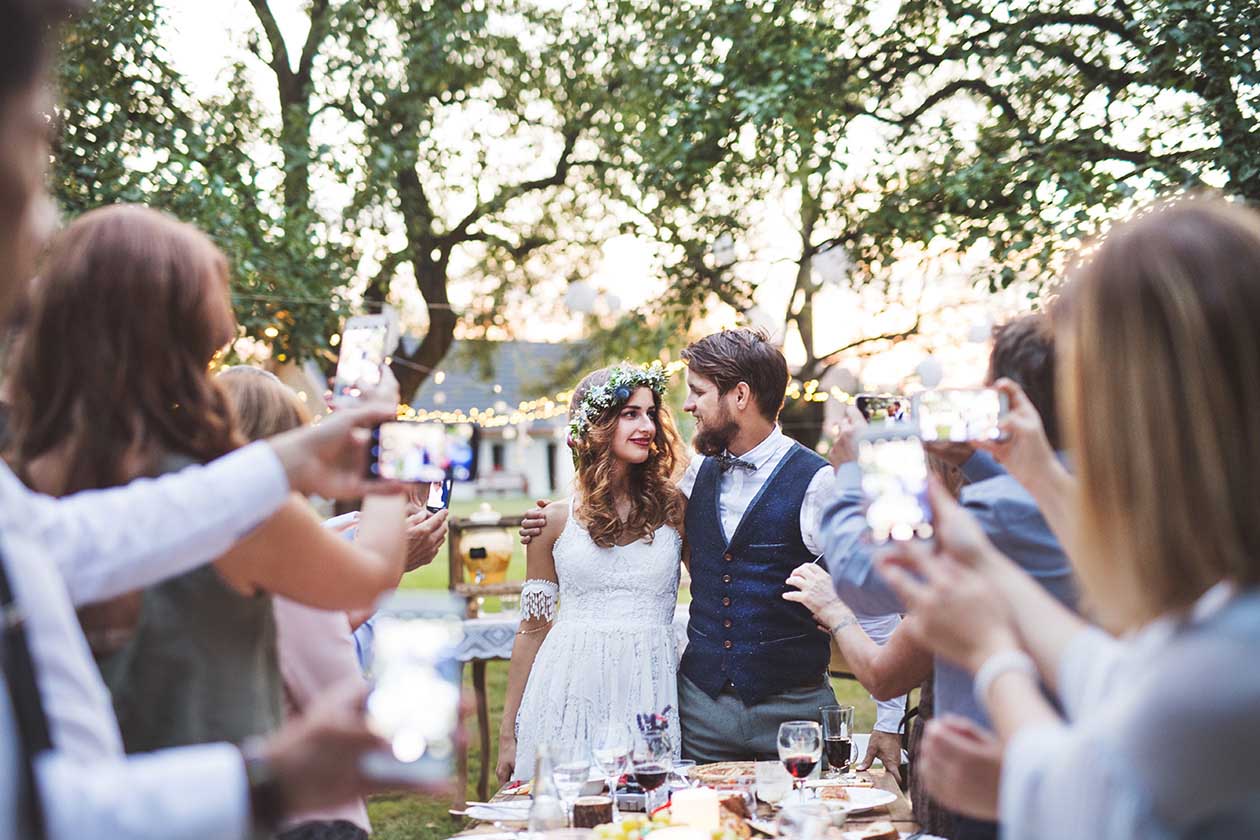 guests-with-smartphones-taking-photo-of-bride-and-2022-02-02-03-47-49-utc1.jpg